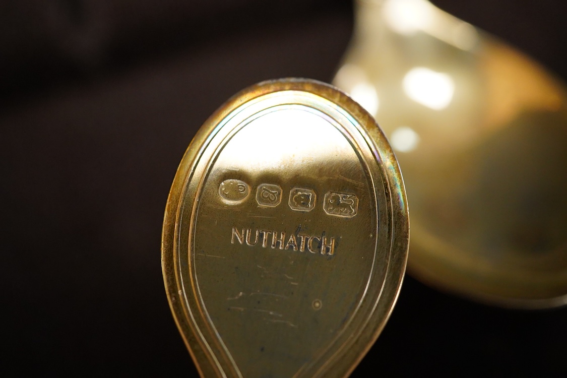 An Elizabeth II cased set of twelve Royal Society for the Protection of Birds parcel gilt silver teaspoons by John Pinches, London, 1975, 13.2cm.